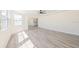 Bright and sunny living space with windows and pass-through to kitchen area at 7322 Mako Dr, Hudson, FL 34667