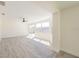 Bright, open living room with modern gray floors and natural light at 7322 Mako Dr, Hudson, FL 34667