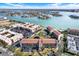 Aerial view showcasing the condo community's proximity to the serene waterfront and lush landscaping at 8711 Blind Pass Rd # 207A, St Petersburg, FL 33706