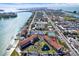 Aerial view of the neighborhood and condo complex with waterfront access at 8711 Blind Pass Rd # 207A, St Petersburg, FL 33706
