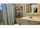 Cozy bathroom with a white vanity, mirror, and a shower/tub combination at 9815 47Th N Ave # 306, St Petersburg, FL 33708