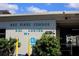 Exterior view of Bay Pines Condos Rec Center features lush landscaping and reserved accessible parking at 9815 47Th N Ave # 306, St Petersburg, FL 33708