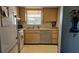 Functional kitchen offers plenty of counter and cabinet space with views of the neighborhood at 9815 47Th N Ave # 306, St Petersburg, FL 33708