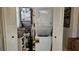 Efficient laundry area with stacked washer/dryer and storage space for household essentials at 9815 47Th N Ave # 306, St Petersburg, FL 33708