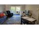 Comfortable living room with sliding glass doors to the balcony for bright natural light at 9815 47Th N Ave # 306, St Petersburg, FL 33708