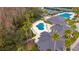 Overhead view of community center, pool, tennis courts, and parking at 10220 Deercliff Dr, Tampa, FL 33647