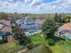 Aerial view of the backyard with a screened-in pool and manicured landscaping at 10220 Deercliff Dr, Tampa, FL 33647