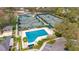 Aerial view of community pool and tennis courts at 10220 Deercliff Dr, Tampa, FL 33647