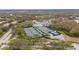 Aerial view of tennis courts, pickleball courts, and a pool at the community clubhouse at 10220 Deercliff Dr, Tampa, FL 33647