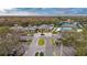 Aerial view of community center with swimming pool, tennis courts, and parking at 10220 Deercliff Dr, Tampa, FL 33647