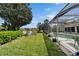 Well-maintained backyard featuring a pool, landscaping, and serene pond views at 10220 Deercliff Dr, Tampa, FL 33647