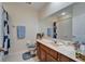 Bright bathroom with a large mirror, a marble countertop, and a shower at 10220 Deercliff Dr, Tampa, FL 33647