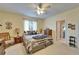 Well-lit primary bedroom with a large window, providing a serene and relaxing retreat at 10220 Deercliff Dr, Tampa, FL 33647