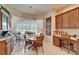 Cozy breakfast nook with wood table, chairs, built in cabinet and natural light at 10220 Deercliff Dr, Tampa, FL 33647