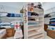 Organized walk-in closet featuring shelves, and hanging space at 10220 Deercliff Dr, Tampa, FL 33647