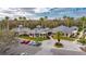 Community clubhouse featuring manicured landscaping and convenient parking at 10220 Deercliff Dr, Tampa, FL 33647