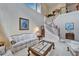 Bright living room featuring a curved staircase, high ceilings, and a large window at 10220 Deercliff Dr, Tampa, FL 33647