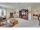 Spacious living room featuring a bookcase, TV, and a comfortable seating area at 10220 Deercliff Dr, Tampa, FL 33647