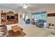 Comfortable living area with plush seating and a view of the screened-in lanai at 10220 Deercliff Dr, Tampa, FL 33647
