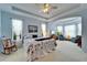 Spacious main bedroom features a tray ceiling and a cozy seating area at 10220 Deercliff Dr, Tampa, FL 33647