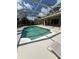 An inviting in-ground pool is surrounded by a spacious screened lanai for the ultimate outdoor living experience at 10220 Deercliff Dr, Tampa, FL 33647