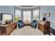 Charming sitting area features matching chairs and a bright window at 10220 Deercliff Dr, Tampa, FL 33647