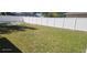 Large backyard featuring a well-maintained lawn and new privacy fence at 105 2Nd Ne Ave, Lutz, FL 33549
