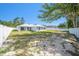 Spacious fenced backyard, perfect for entertaining, with a covered patio and lush lawn at 105 2Nd Ne Ave, Lutz, FL 33549