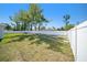 Large backyard featuring green grass and privacy fence at 105 2Nd Ne Ave, Lutz, FL 33549