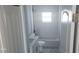 Bathroom featuring a shower-tub combo with tiled surround, and updated vanity with solid-surface countertops at 105 2Nd Ne Ave, Lutz, FL 33549