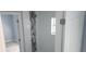 Shower-tub combo featuring decorative tile and a shower niche for bath products at 105 2Nd Ne Ave, Lutz, FL 33549