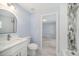 Bathroom featuring a vanity, toilet and shower/tub combo at 105 2Nd Ne Ave, Lutz, FL 33549
