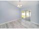 Bright dining room with tile floors and sliding glass doors to the backyard patio at 105 2Nd Ne Ave, Lutz, FL 33549