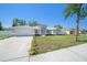 Charming single-story home featuring manicured lawn, neutral color palette and attached two car garage at 105 2Nd Ne Ave, Lutz, FL 33549