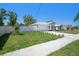 Charming single-story home featuring manicured lawn, neutral color palette and attached two car garage at 105 2Nd Ne Ave, Lutz, FL 33549