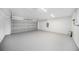 Clean garage featuring epoxy floor and neutral paint at 105 2Nd Ne Ave, Lutz, FL 33549