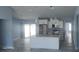 Open concept kitchen with granite countertops, stainless steel appliances, and a large island at 105 2Nd Ne Ave, Lutz, FL 33549
