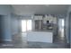 Open concept kitchen with granite countertops, stainless steel appliances, and a large island at 105 2Nd Ne Ave, Lutz, FL 33549