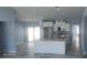 Open concept kitchen with granite countertops, stainless steel appliances, and a large island at 105 2Nd Ne Ave, Lutz, FL 33549