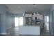 Bright kitchen with stainless steel appliances, white cabinets, and a large center island with seating at 105 2Nd Ne Ave, Lutz, FL 33549