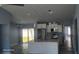 Open concept kitchen with granite countertops, stainless steel appliances, and a large island at 105 2Nd Ne Ave, Lutz, FL 33549