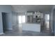 Open concept kitchen with granite countertops, stainless steel appliances, and a large island at 105 2Nd Ne Ave, Lutz, FL 33549