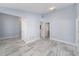 Open living area with tile floors and multiple doorways at 105 2Nd Ne Ave, Lutz, FL 33549