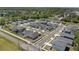 Aerial view of neighborhood with tree-lined streets and sidewalks in a Gathering-friendly community at 1050 Davis Heather Cir, Seffner, FL 33584