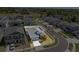 Aerial view of modern home on well-manicured lot surrounded by white fencing in quiet neighborhood at 1050 Davis Heather Cir, Seffner, FL 33584
