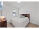 Inviting bedroom featuring a comfortable bed, modern decor, and a serene atmosphere at 1050 Davis Heather Cir, Seffner, FL 33584
