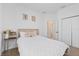 Serene bedroom with a cozy bed, elegant bedside table, and plenty of natural light at 1050 Davis Heather Cir, Seffner, FL 33584