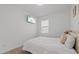 Comfortable bedroom featuring a plush white bed, soft lighting, and modern decor at 1050 Davis Heather Cir, Seffner, FL 33584