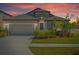 Charming single-Gathering home with a well-manicured lawn and attached two-car garage at 1050 Davis Heather Cir, Seffner, FL 33584