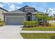 Charming single-Gathering home with a well-manicured lawn and attached two-car garage at 1050 Davis Heather Cir, Seffner, FL 33584